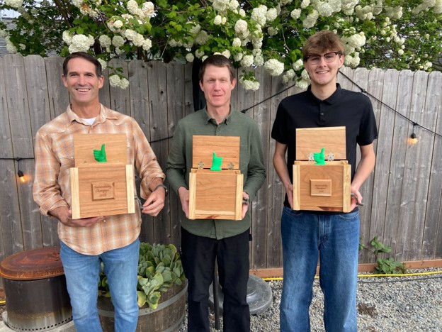 Photo of the 2026 Sustainability Champion Award winners. (L to R) Dr. Justus Ortega (accepting the award on behalf of Dr. Jennifer Ortega), Christopher Dubois, and Riley McDaniel